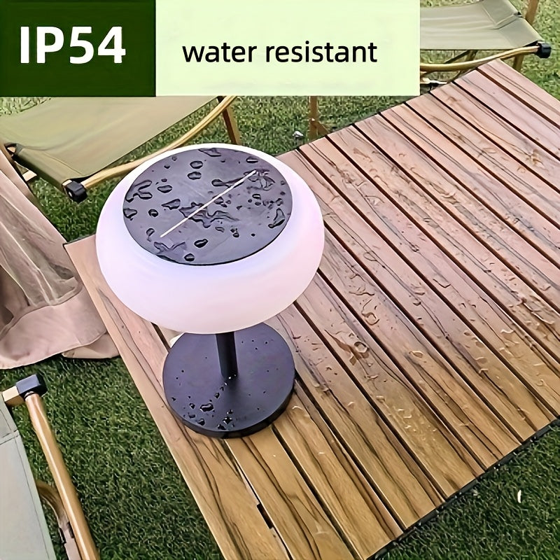A rechargeable table lamp with smart remote control and dusk-to-dawn activation sensor. This wireless bedside lamp can be powered by solar energy and offers adjustable brightness, perfect for camping.