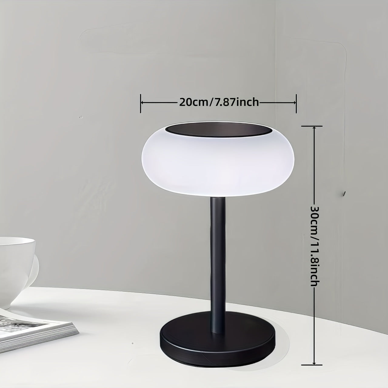 A rechargeable table lamp with smart remote control and dusk-to-dawn activation sensor. This wireless bedside lamp can be powered by solar energy and offers adjustable brightness, perfect for camping.