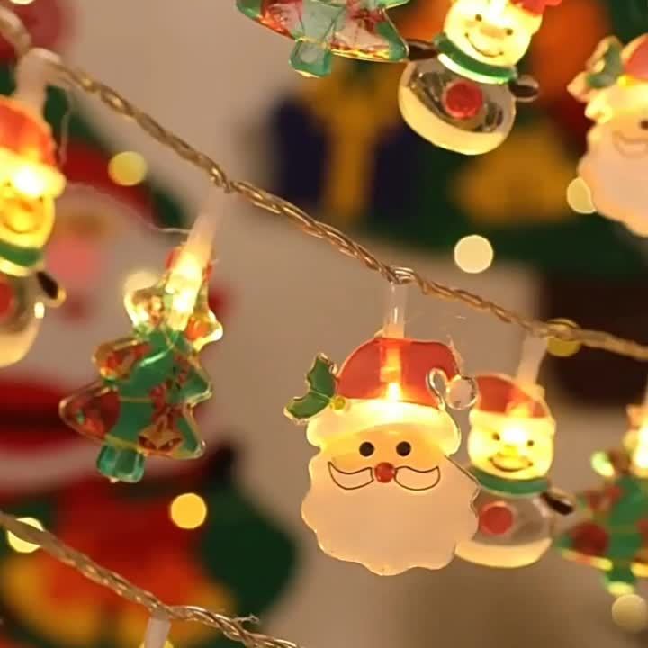 一串聖誕燈串，包含聖誕老人、聖誕樹和雪人，非常適合在聖誕節、感恩節、新年、家庭聚會和派對期間裝飾。有10顆或20顆燈可選（不含電池）