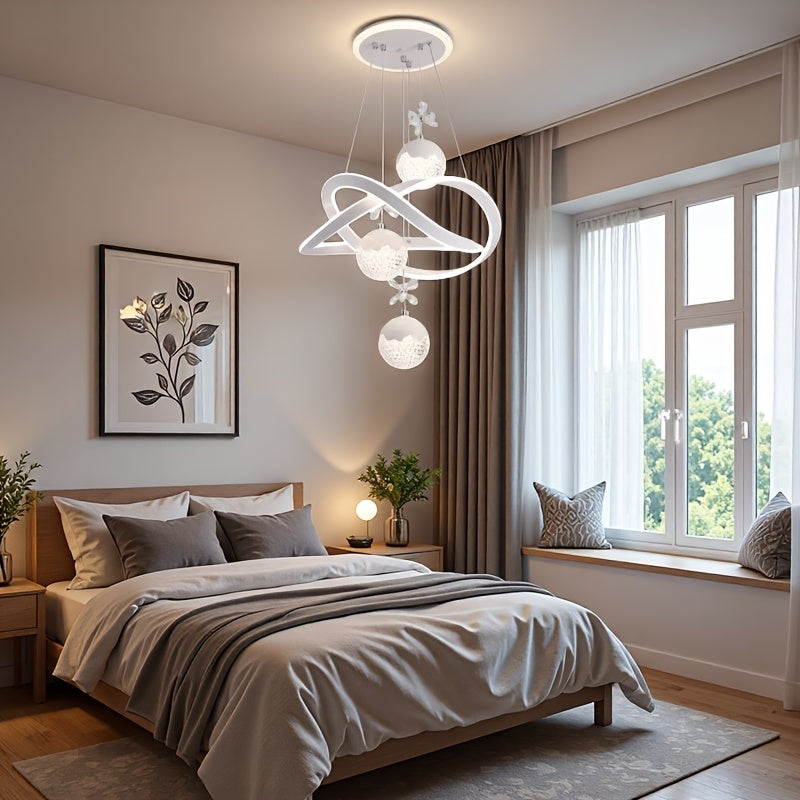 An LED pendant light with 3 spherical lamp heads and a surrounding light ring, featuring adjustable three color temperatures, adjustable height, and illuminated base; suitable for living room, dining room, bedroom, etc
